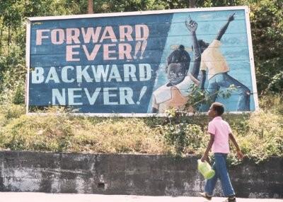 "Forward ever, backward never" billboard in Grenada | Zinn Education Project